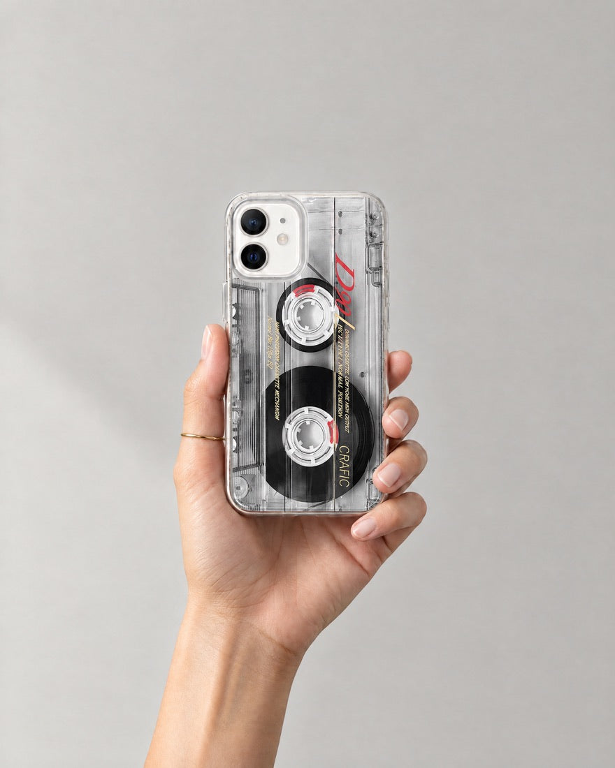 A hand holding the Cassette Tape case