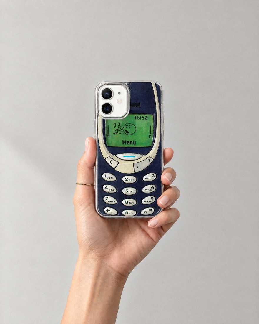 A hand holding the Old Mobile case
